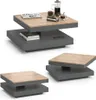 A set of three modern coffee tables with a two-tiered design, featuring a dark gray base and a light wood top. The largest table is shown with books, a coffee press, and a cup. Voir les images du produit