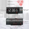 A digital alarm clock with projected time and temperature, shown with labels indicating its features. Podgląd zdjęcia produktu