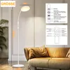 A white LED floor lamp is shown in a living room setting next to a sofa. There are diagrams illustrating the lamp's features and remote control. Produktbild-Vorschau