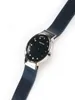 A close-up, angled shot of a Bering watch with a blue mesh strap and a dark blue dial, set against a white background. Náhľad obrázku produktu