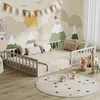 A child's bedroom with a low bed, toys, and a mountain-themed mural. Anteprima dell’immagine prodotto