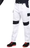 A person wearing work pants and shoes, standing against a white background. Produktbild-Vorschau