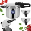 A collage of images showing a stainless steel pressure cooker from different angles, along with close-ups of its lid mechanism and decorative elements like red peppers and green leaves. Podgląd zdjęcia produktu