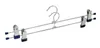A pair of metal hangers for pants or skirts, with clips. Anteprima dell’immagine prodotto