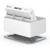 A white humidifier with a filter inside, resting on a silver base. Podgląd zdjęcia produktu