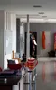 A hallway in a building with a mug on a shelf in the foreground. Produktbild-Vorschau
