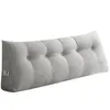 A gray tufted wedge pillow with side pockets, shown against a white background. Produktbild-Vorschau