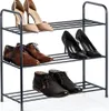 A three-tiered black metal shoe rack filled with various shoes. Produktbild-Vorschau