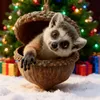 A cute lemur peeking out of an acorn ornament, with a decorated Christmas tree and gifts in the background. Produktbild-Vorschau