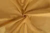 A close-up shot of crumpled gold fabric. Produktbild-Vorschau