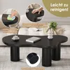 A black coffee table with a unique cloud shape is shown in a living room setting, with close-up insets highlighting its features and cleaning ease. Voir les images du produit