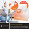 A pregnant woman is doing yoga on a large blue exercise ball in a living room. An infrared heater is shown in the background with marketing text and graphics. Produktbild-Vorschau