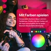 Two young women playing video games with colorful lighting. Produktbild-Vorschau