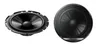 Two car speakers are shown against a white background. One speaker is shown from the side, and the other is shown from the front. Podgląd zdjęcia produktu