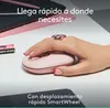 A hand wearing a rose gold ring is using a pink Logitech POP mouse on a white desk. A tablet and a pink object are in the background. Náhľad obrázku produktu