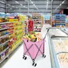A pink shopping trolley filled with groceries is in a supermarket aisle. Voir les images du produit
