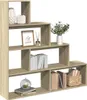 A multi-level bookshelf with various decorative items and books. Produktbild-Vorschau