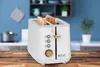 A white toaster with two slices of toast in it, placed on a wooden table in a kitchen setting. Voir les images du produit