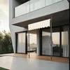 A modern house with a patio and an awning extended over the sliding glass doors. Náhled obrázku produktu