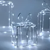 Three illuminated gift box decorations with white LED lights against a light gray background. Podgląd zdjęcia produktu