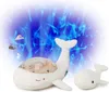 Two plush whale toys are shown in front of a blue, wavy light projection. Anteprima dell’immagine prodotto