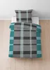 A duvet cover and pillowcase set with a plaid pattern is laid out on a white surface. Produktbild-Vorschau