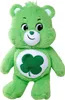 A green plush bear with a shamrock on its chest is shown against a white background. Produktbild-Vorschau