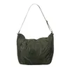 A green duffel bag with a strap, shown against a white background. Produktbild-Vorschau