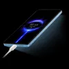 A smartphone is shown charging with a glowing charging animation on its screen. Produktbild-Vorschau