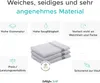 A marketing image showcasing a stack of folded towels with feature callouts. Produktbild-Vorschau