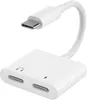 A white USB-C adapter with ports for headphones and charging. Náhled obrázku produktu