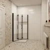 A modern bathroom with a glass shower enclosure. Produktbild-Vorschau