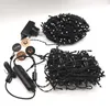 A product shot of Twinkly Strings 600 RGBW intelligent Christmas tree lights, including the power adapter and some decorative stickers. Anteprima dell’immagine prodotto
