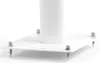 A close-up view of the base of a white speaker stand with four metal spikes and four metal nuts. Náhled obrázku produktu