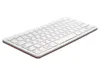 A white keyboard with a red accent is shown from a diagonal angle against a white background. Produktbild-Vorschau