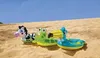Three inflatable animal swim rings are placed on a sandy beach with a blue sky in the background. Produktbild-Vorschau