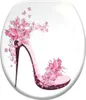 A decorative toilet seat cover featuring a high-heeled shoe adorned with pink flowers and butterflies. Náhled obrázku produktu