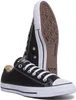 A pair of black Converse sneakers shown from a low angle, with one shoe in the foreground and the other behind it. Voir les images du produit