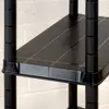 A close-up view of a black plastic shelf unit. Náhled obrázku produktu