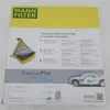 The image shows the packaging of a MANN FILTER FreciousPlus cabin air filter, detailing its three-layer filter technology and benefits. Produktbild-Vorschau