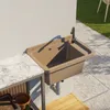 An outdoor sink with a faucet mounted on a wall next to a marble countertop. Anteprima dell’immagine prodotto