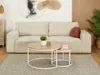 A living room scene with a couch, coffee tables, and decor. Podgląd zdjęcia produktu