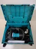 An open teal plastic case containing a tool and accessories. Podgląd zdjęcia produktu