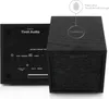 A close-up view of a black Tivoli Audio speaker, showing both the front grille and the back panel with controls and ports. A diagram highlights the capacitive touch-sensitive logo on the top surface. Produktbild-Vorschau