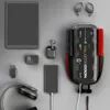 A collection of electronic devices and accessories arranged on a gray surface. Produktbild-Vorschau
