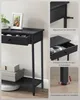 A collage of images showing a black console table with drawers, highlighting its features like anti-tip protection, drawer handles, and adjustable feet. Produktbild-Vorschau