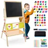 A young boy is giving a thumbs up next to a wooden easel with a blackboard, whiteboard, and educational accessories. Produktbild-Vorschau
