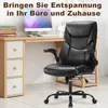 A black office chair is placed in front of a wooden desk with a computer and books. Voir les images du produit