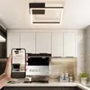 A modern kitchen with white cabinets, a black range hood, and a square LED ceiling light. Voir les images du produit