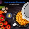 An air fryer filled with french fries is shown next to fresh vegetables and a graphic indicating low oil usage. Produktbild-Vorschau